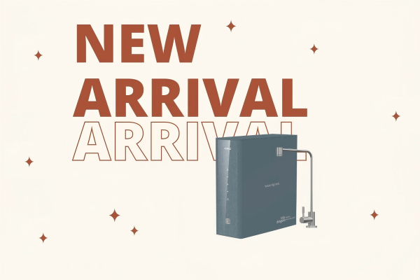 A modern, compact water purifier on a stylish apartment kitchen counter